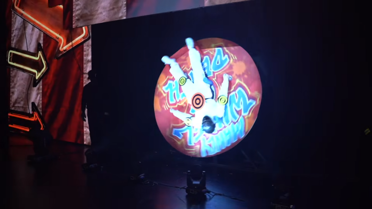 Pastor Gets Shot On Stage With Paintball Gun While Spinning Upside Down